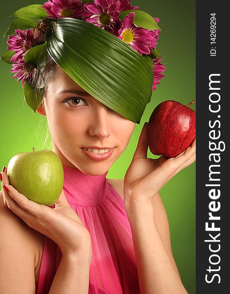Beautiful spring-woman with two apples. Beautiful spring-woman with two apples