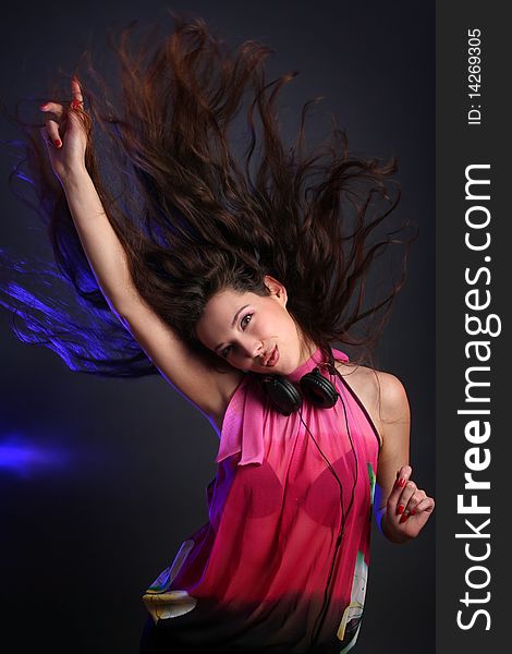 young woman dancing with headphones. young woman dancing with headphones