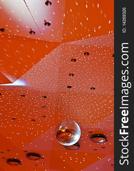 Vertical photo of a disco ceiling with disco-ball and small light reflections,. Vertical photo of a disco ceiling with disco-ball and small light reflections,