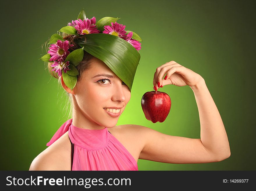 Beautiful spring-woman with red apple