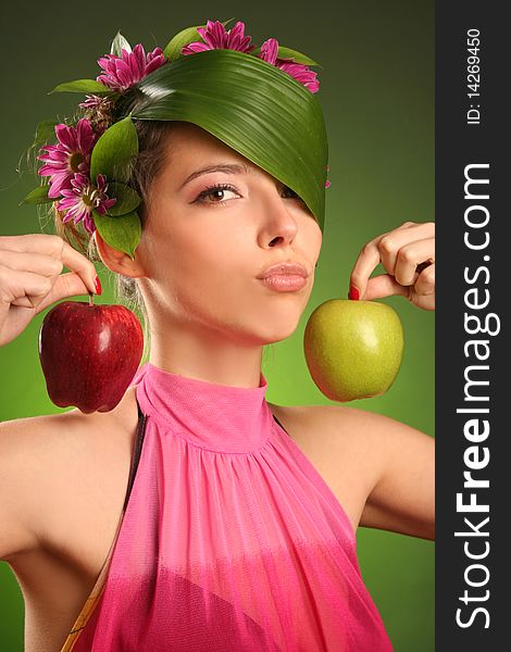 Beautiful spring-woman with two apples