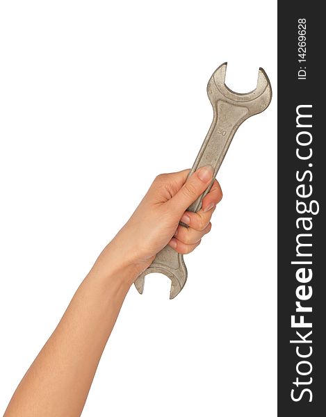 Woman holding a spanner in the hand