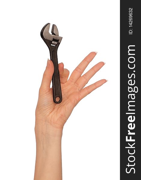Woman holding an adjustable spanner in the hand