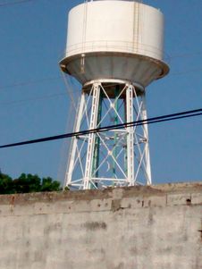 METALLIC WATER TANK FOR INDUSTRIAL USE ELEVATED AT GREAT HEIGHT Royalty Free Stock Image METALLIC WATER TANK FOR INDUSTRIAL USE ELEVATED AT GREAT HEIGHT Royalty Free Stock Image