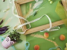 Free Decorative Seasonal Composition Of Fruits, Decor, Greens And A White Frame On Green Toned Paper Stock Photo - 142620100