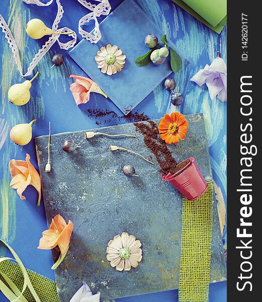 Seasonal summer composition of fruits, flowers and decor on a blue background, top view