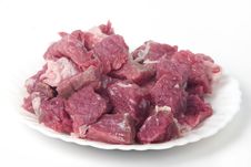 Raw Meat On The Plate, Chopped In Blocks Stock Images