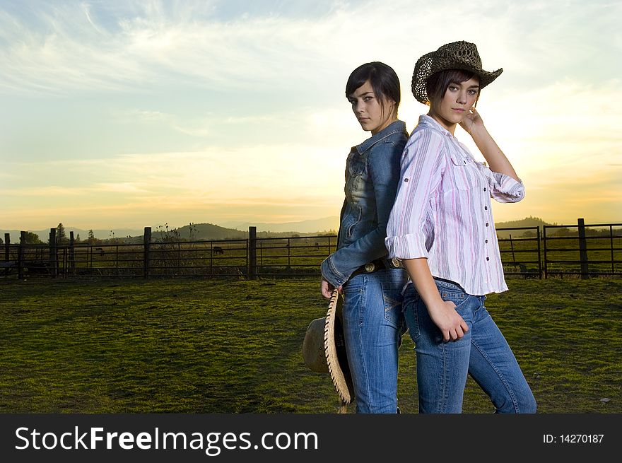 Twin cowgirls in a coral