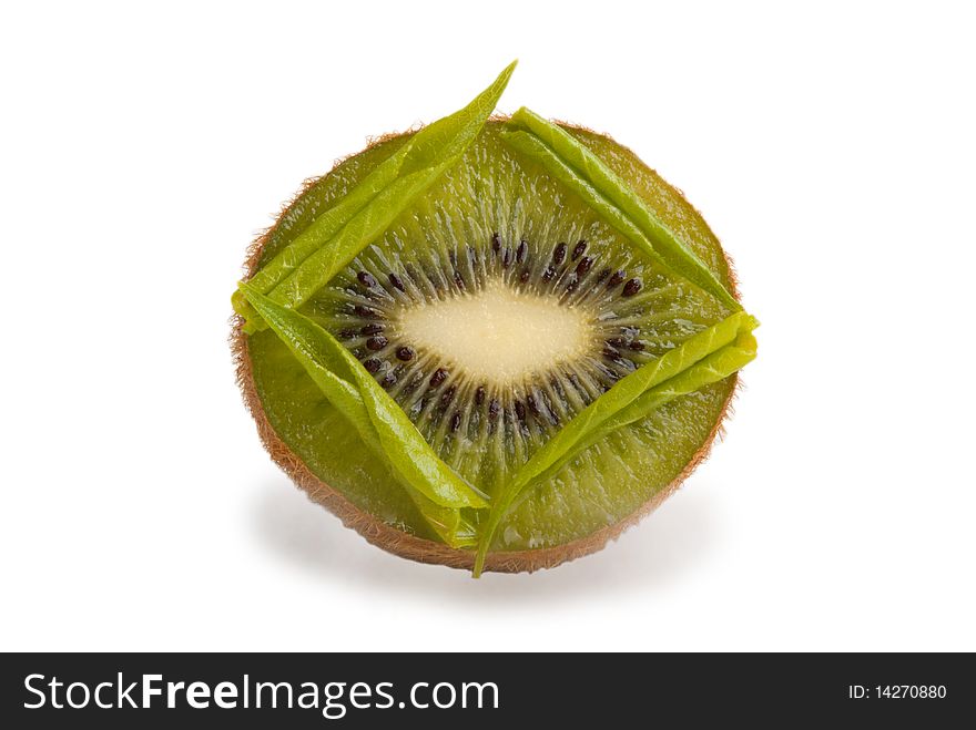 Tree leaflets lie square onhalf kiwi isolated in white