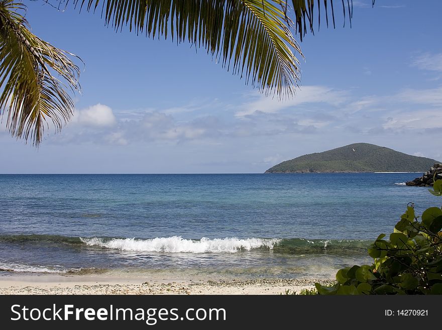 Island beach scene blue sky and water. Island beach scene blue sky and water