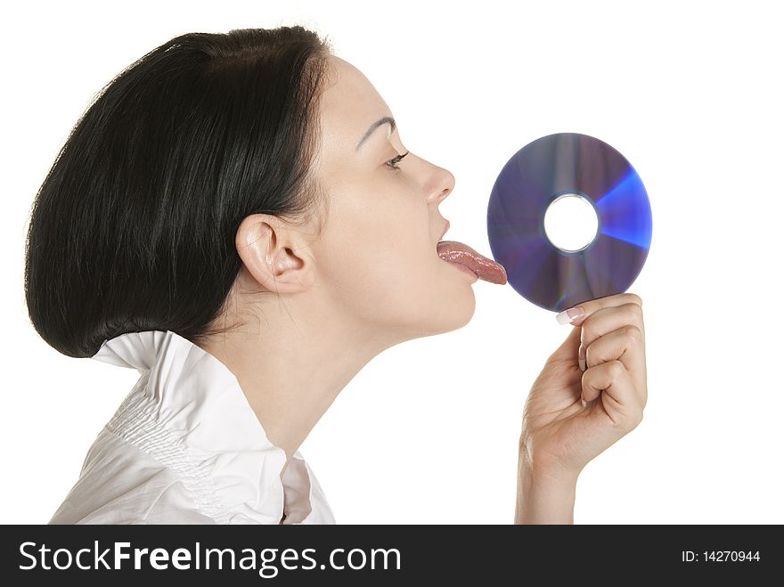 Young woman licks optical disk isolated in white