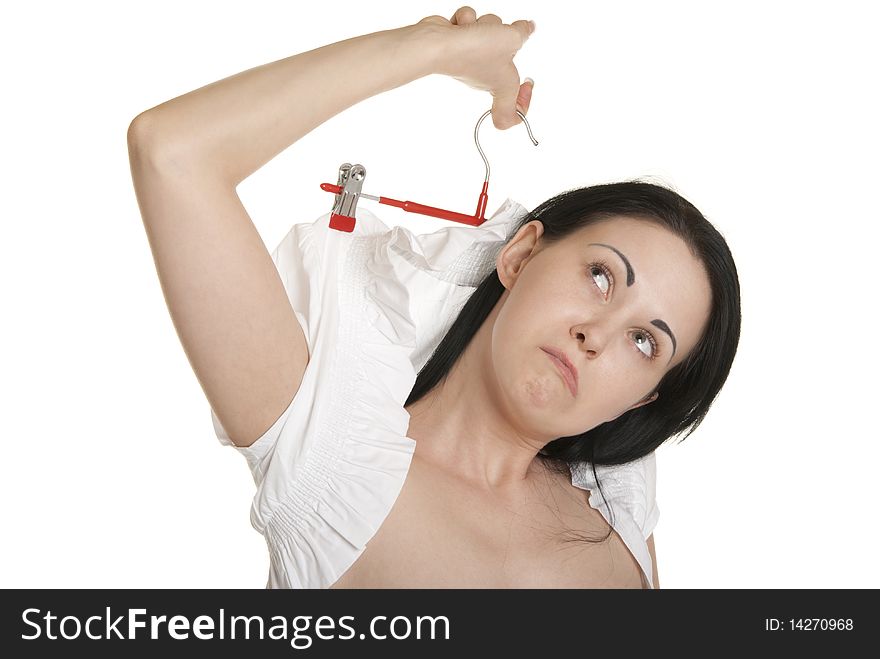 Woman lifts itself for coat hanger for clothes