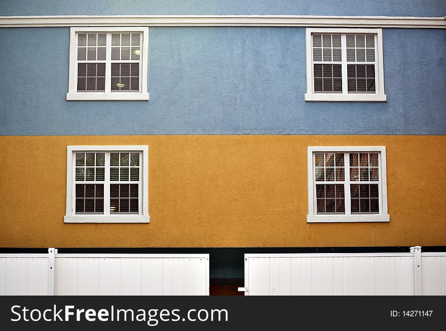 Colorful building with white window frame. Colorful building with white window frame