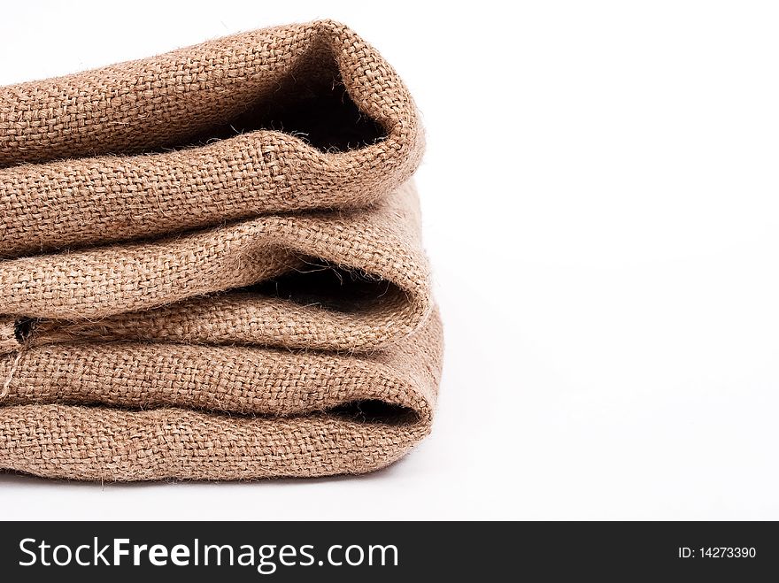 Pile of sackcloth material on white