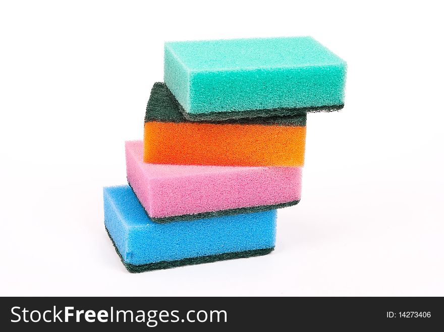 Multi-coloured kitchen sponges on white