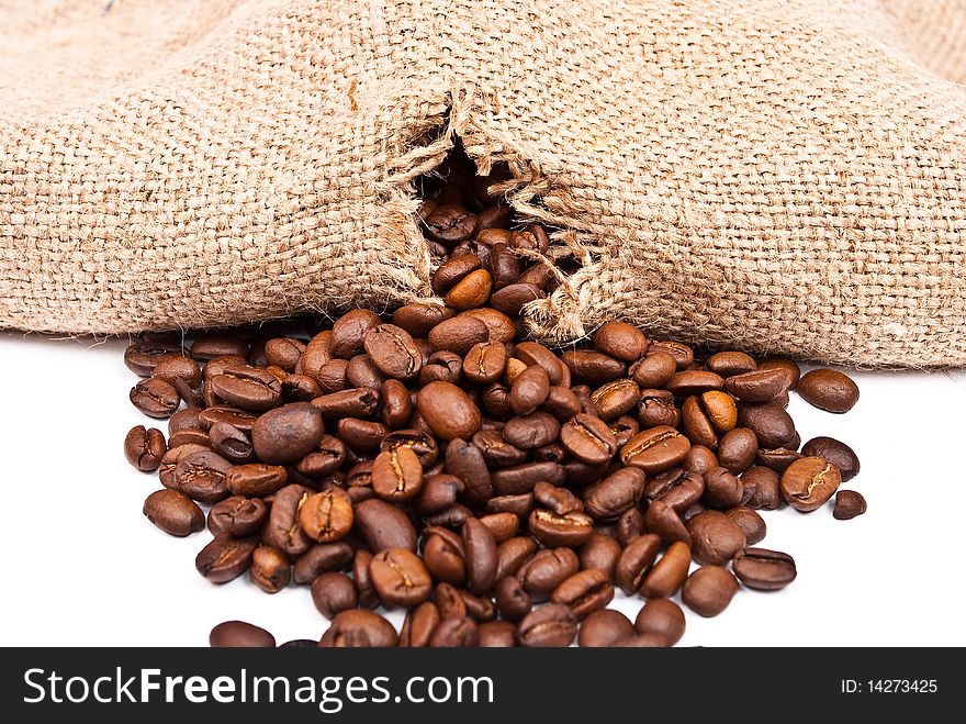 Sack with coffee beans on white