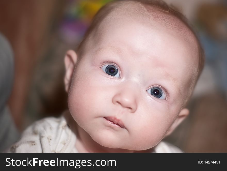 Close up photo of a beautiful baby girl with blue eyes