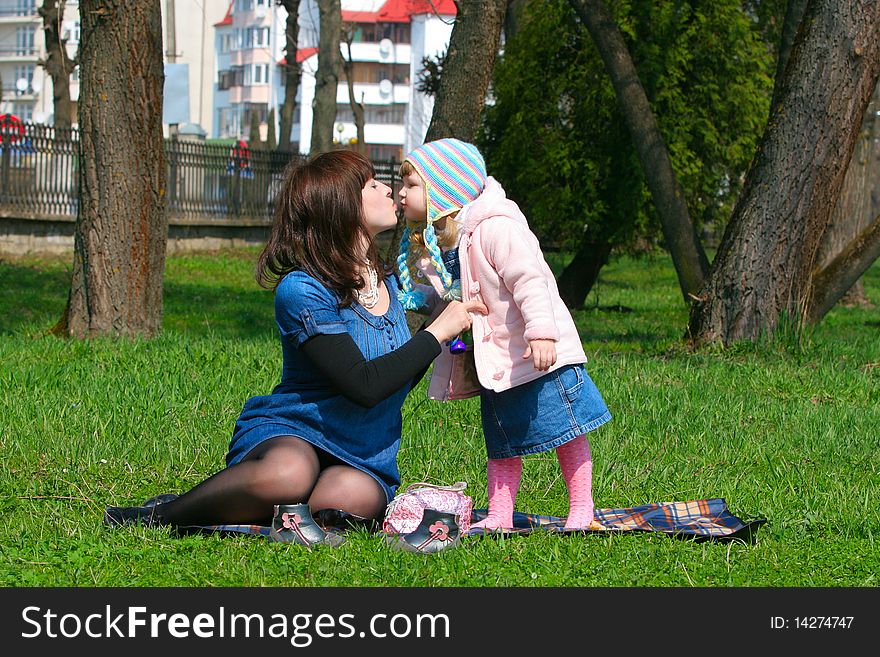 Mother and daughter have a picnic