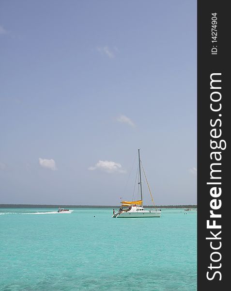 Catamarana and people swiming in caribbean sea