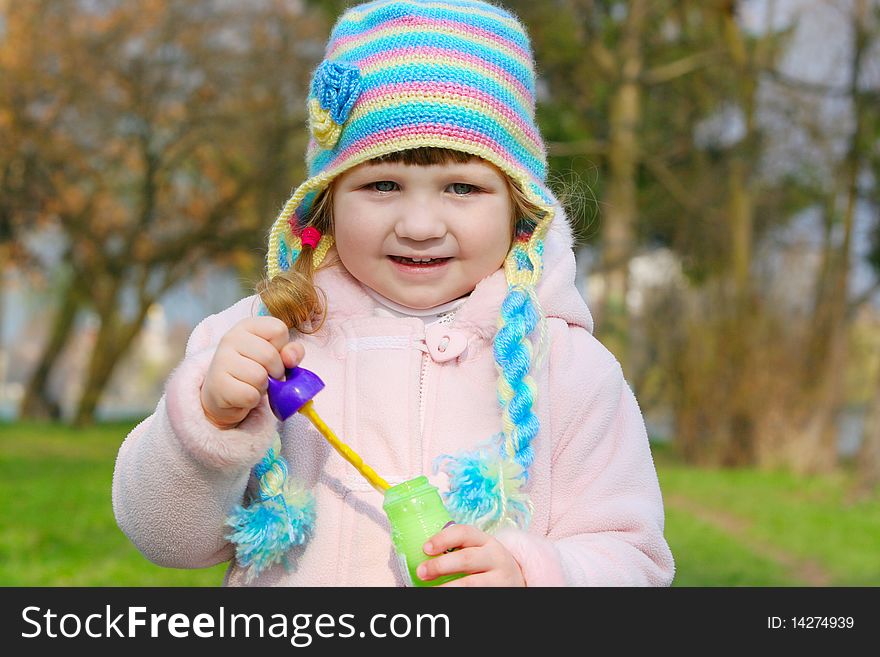 Girl is blowing soap bubbles