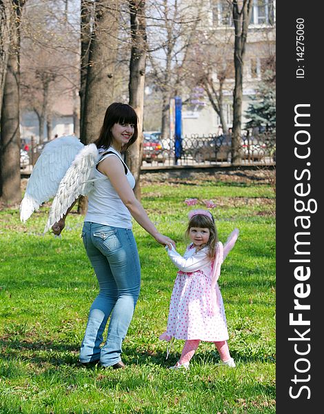 Young girl and mother with wings