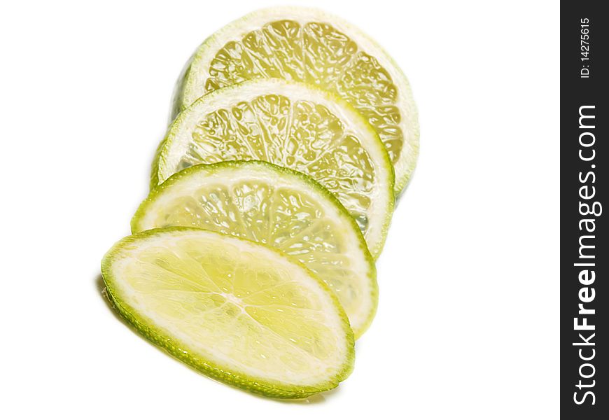 Fresh green lime fruit towards white background