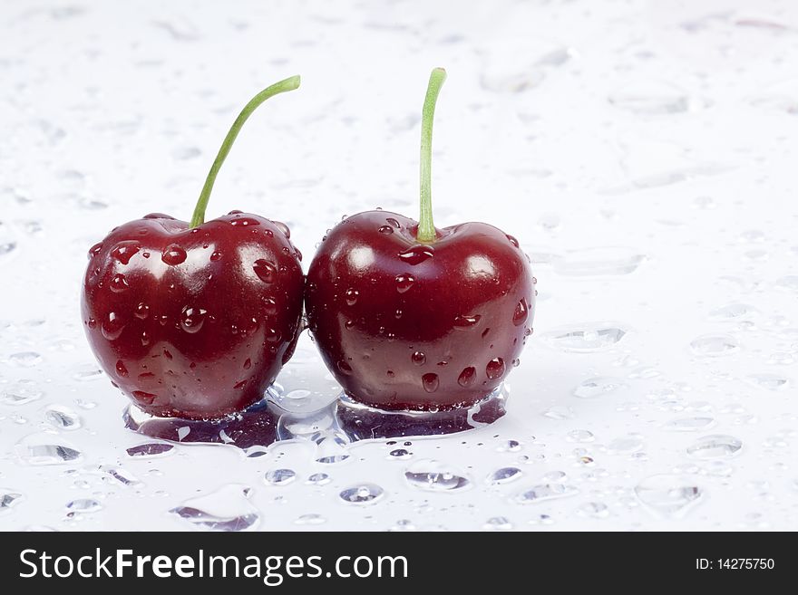 Two cherries on white background. Two cherries on white background