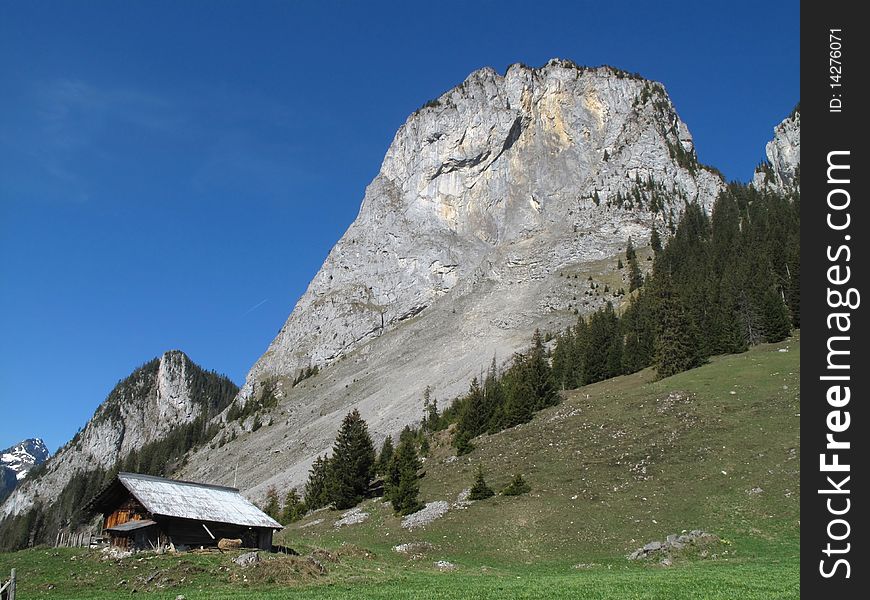 Summit of Mittagflue in Simmental, Bernese Alps, Switzerland; Climbing rout called Sandmeierrippe runs over the ridge on the left side