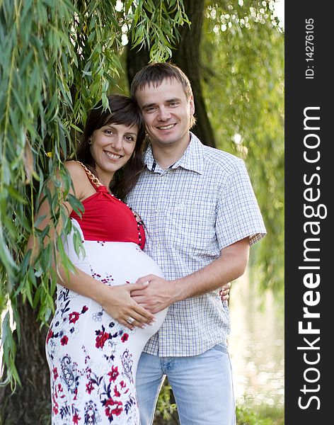 Happy pregnant woman with husband. Happy pregnant woman with husband