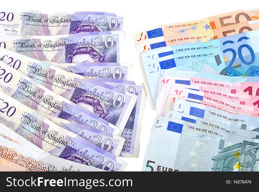 Pile of British and Euro money on white background