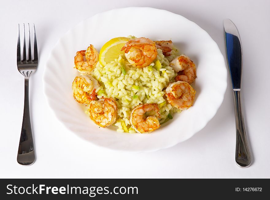 Risotto with fried prawns and avocado macro shot background