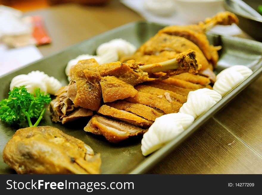 Fried crispy duck served with buns