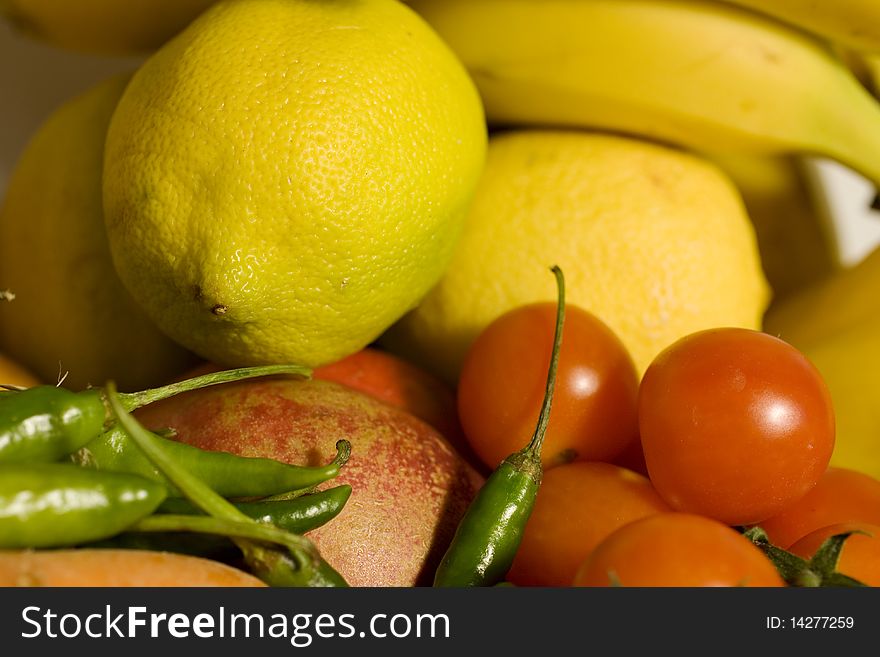 Lemon tomatoes and little green peppers. Lemon tomatoes and little green peppers