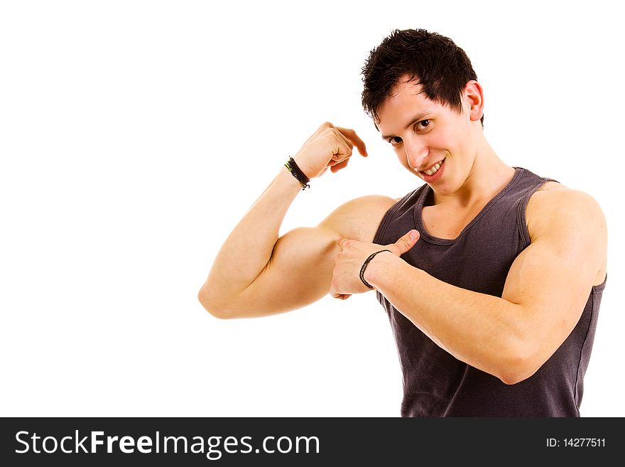 Young atletic man showing biceps, on white background