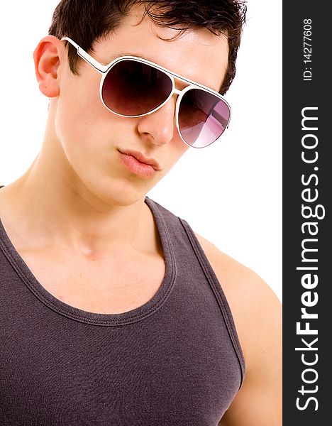 Portrait of stylished young man wearing sunglasses on white background