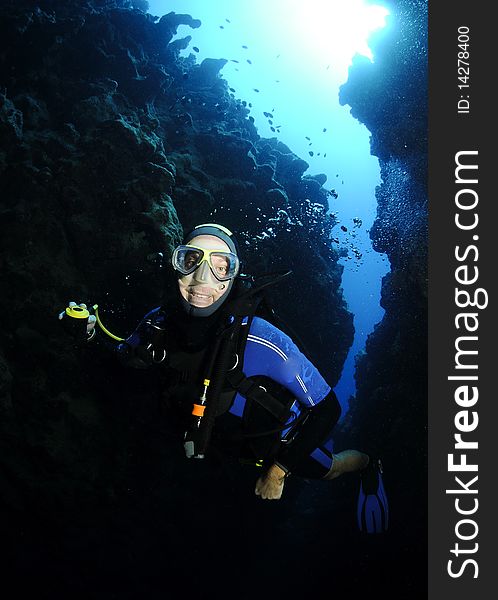 Scuba diver in underwater canyon. Scuba diver in underwater canyon