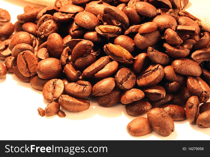 Coffee beans set in orange lighting shot in Macro
