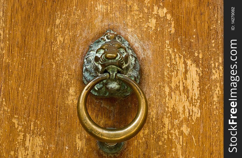 Antique door knocker as lion head