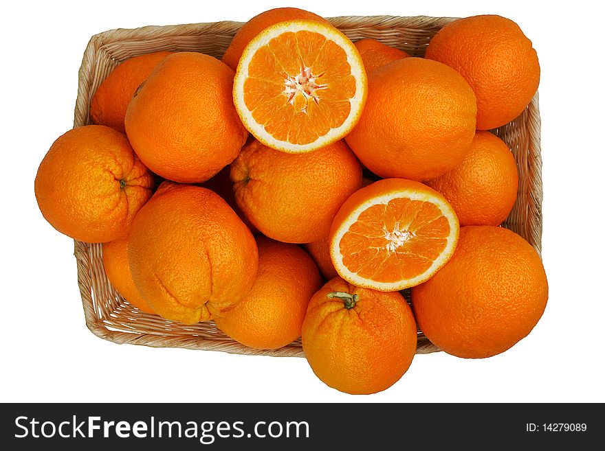 A basket of fresh organic oranges. A basket of fresh organic oranges