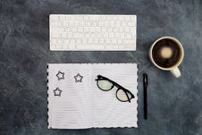 Work Space. Office Space. Black Paper Clips And Pen On Opened Blank Copybook, Coffee, Glasses On Dark Black Abstract Stock Images