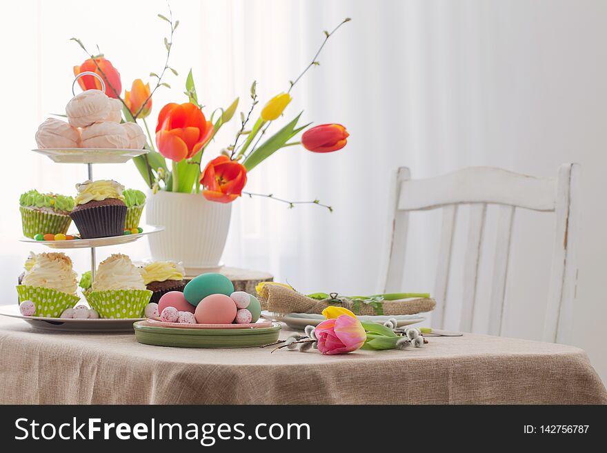 Easter table with tulips and decorations