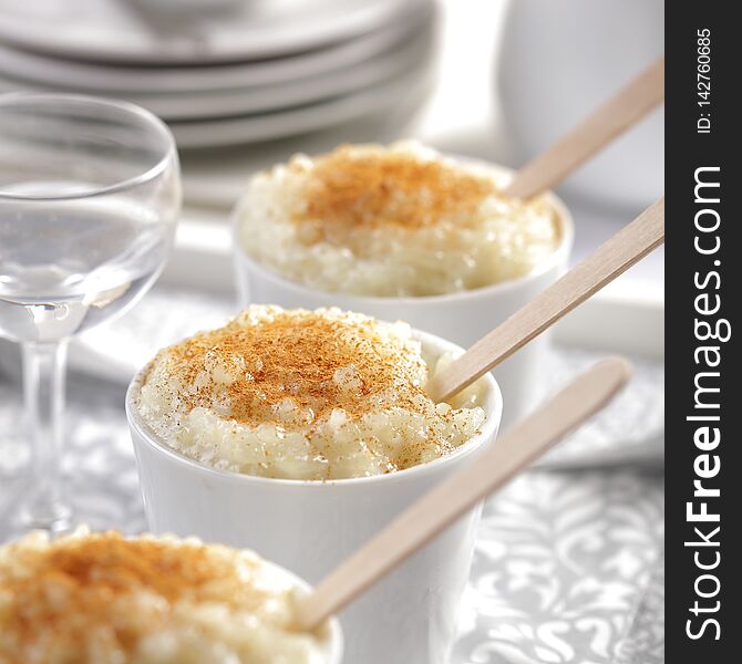 Close-up of rice pudding dessert covered with cinnamon