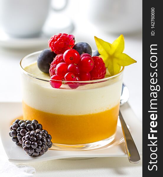 Cheesecake mousse dessert served with fruit in a glass