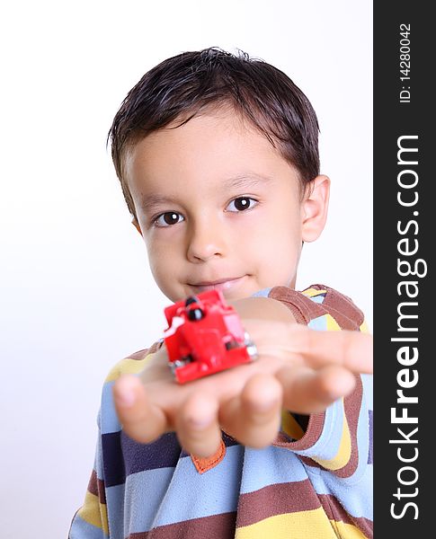 Happy boy with a cart in hand over white background. Happy boy with a cart in hand over white background.