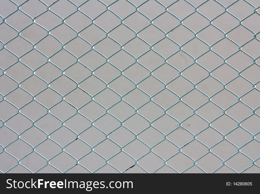 Old hemp fishing net against a white background.