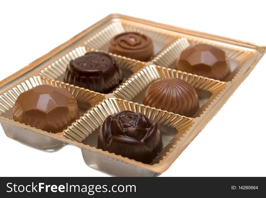 Chocolate candy in a box on white background. Chocolate candy in a box on white background