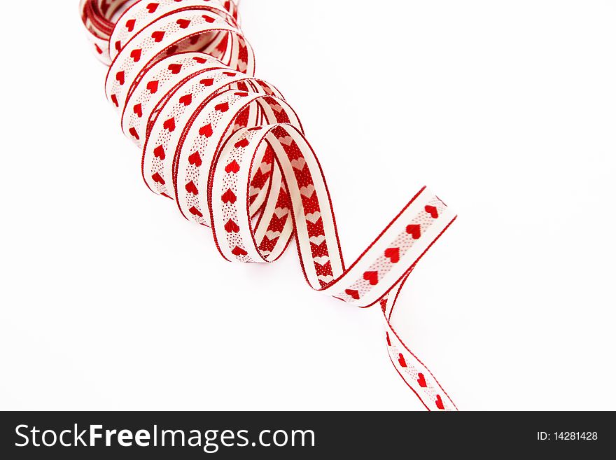 Ribbon with red hearts isolated on a white background