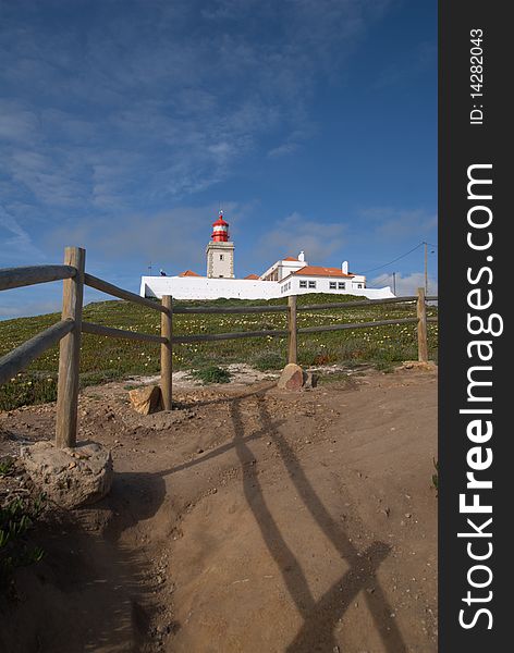 The path to a lighthouse on top of a hill