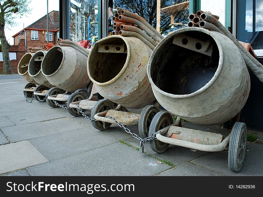 Row of concrete mixers on the pavement