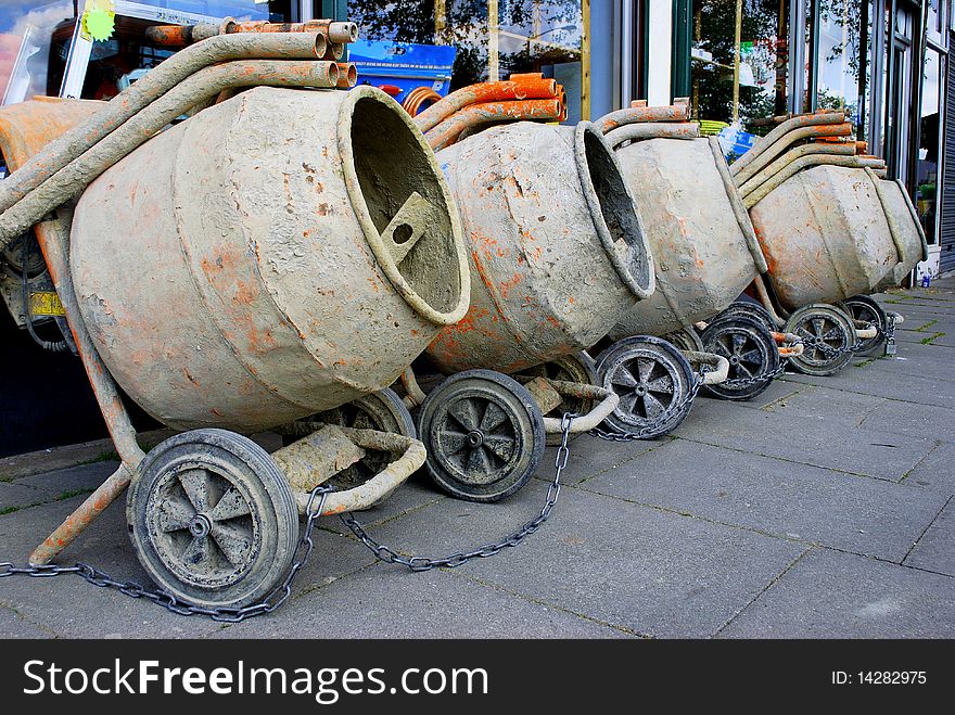 Row of concrete mixers on the pavement